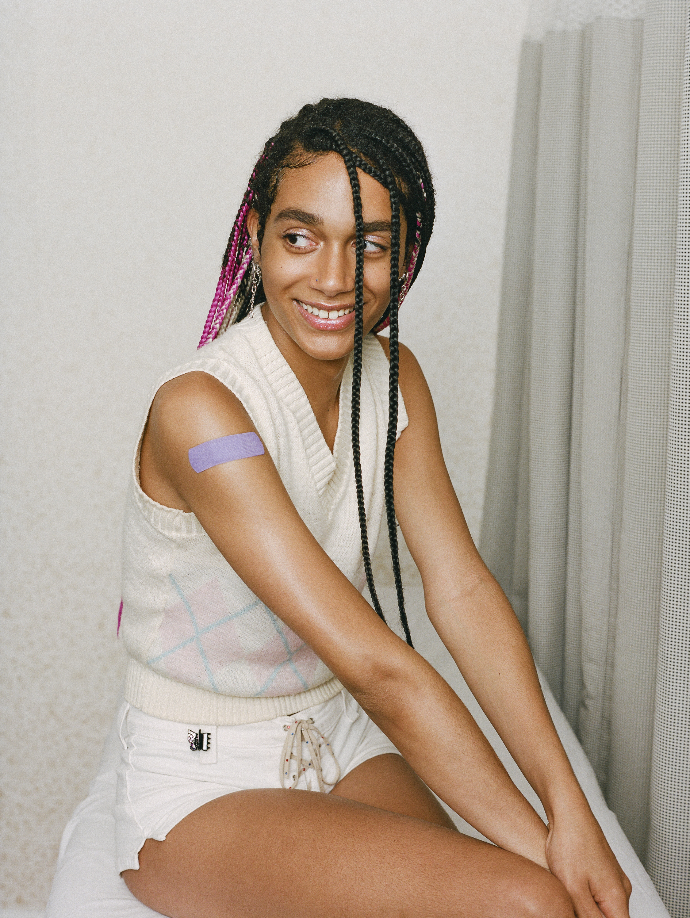 Woman_with_band-aid_on_her_upper_arm_(48546134152)